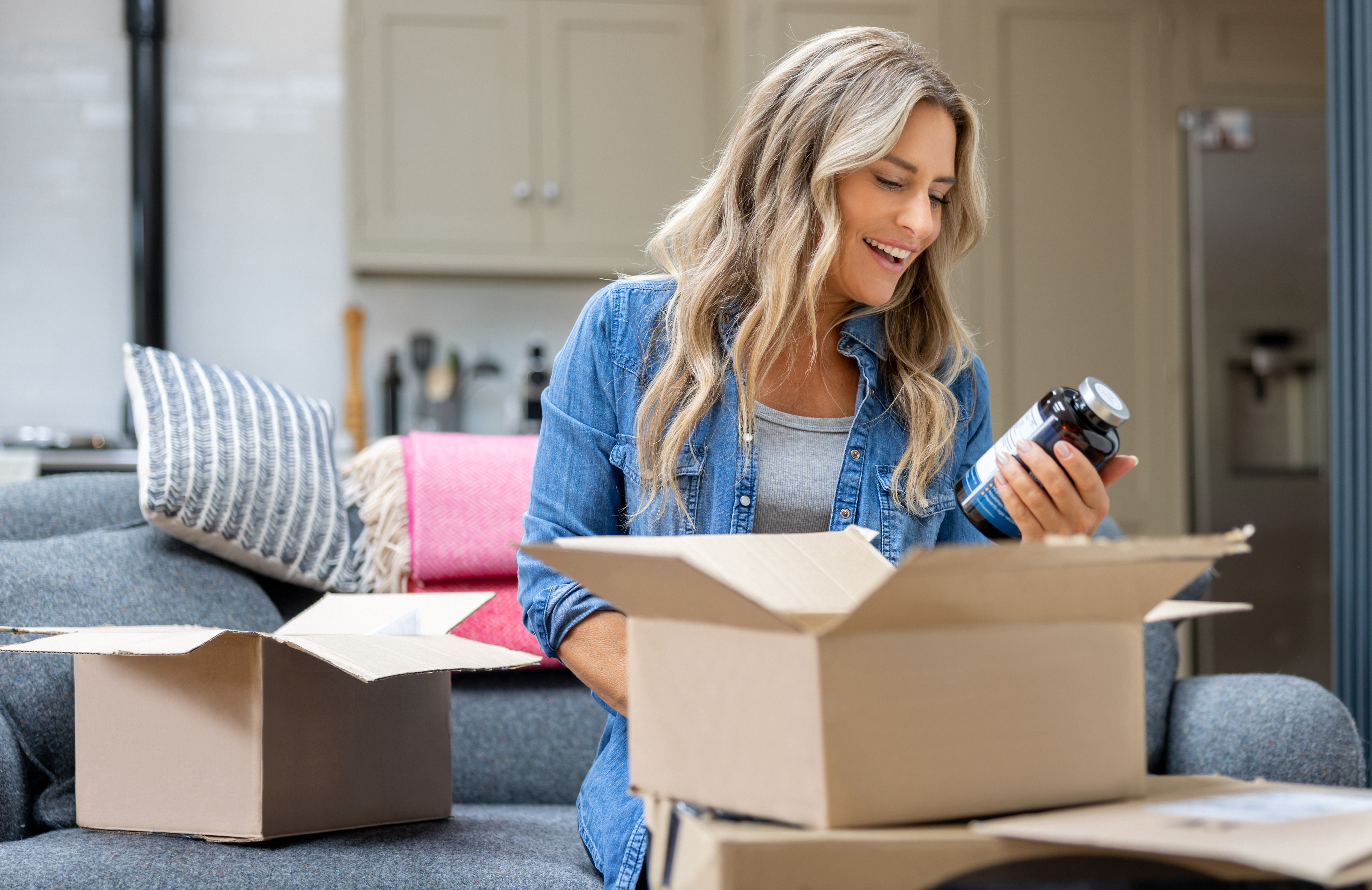 A woman opening a package