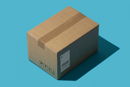 A sealed cardboard box with a shipping label.