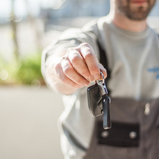 Person handing over keys