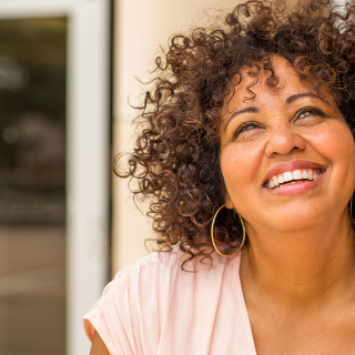 A mature woman smiling confidently